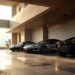 Garage de supercars de luxe à Monaco, avec un SUV, une berline sportive et une supercar, éclairés de façon élégante et réaliste avec reflets sur les carrosseries.
